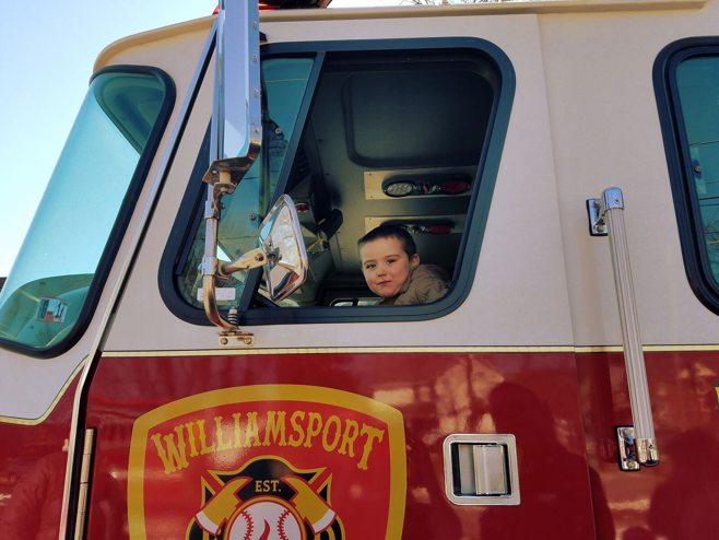 child in firetruck child in firetruck